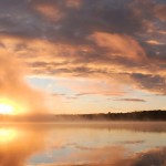Sunrise In Fall An early morning sunrise burning off the mist on the lake.